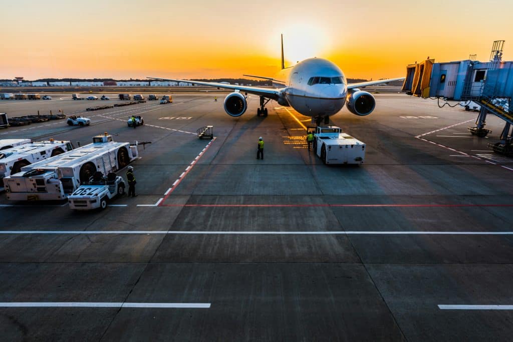 Plane at an airport during sunset
