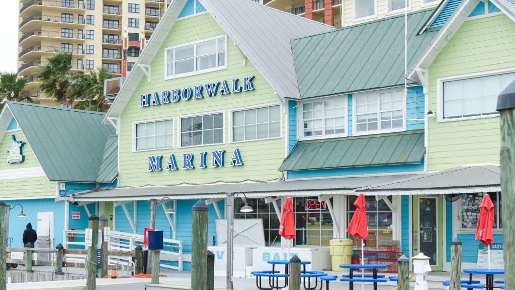 Destin FL, United States - December 27, 2024: HarborWalk Marina features vibrant architecture and outdoor seating, capturing the essence of coastal life in Destin, Florida